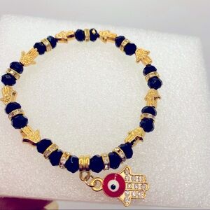 Bracelet Evil Eye Black iridescent beads. 8 1/4 in